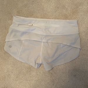 White 2.5 inch lululemon speed up shorts. Low rise size 0.